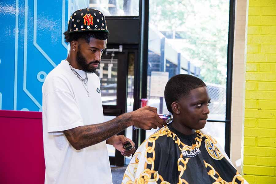"Ready, Set, Learn" Event - CIS of Houston - student getting a haircut