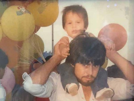 Rey Saldaña (as a child) and his dad